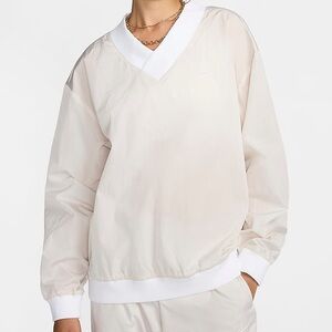 Nike Sportswear Essential Women's Loose UV Woven Long-Sleeve V-Neck Top Large